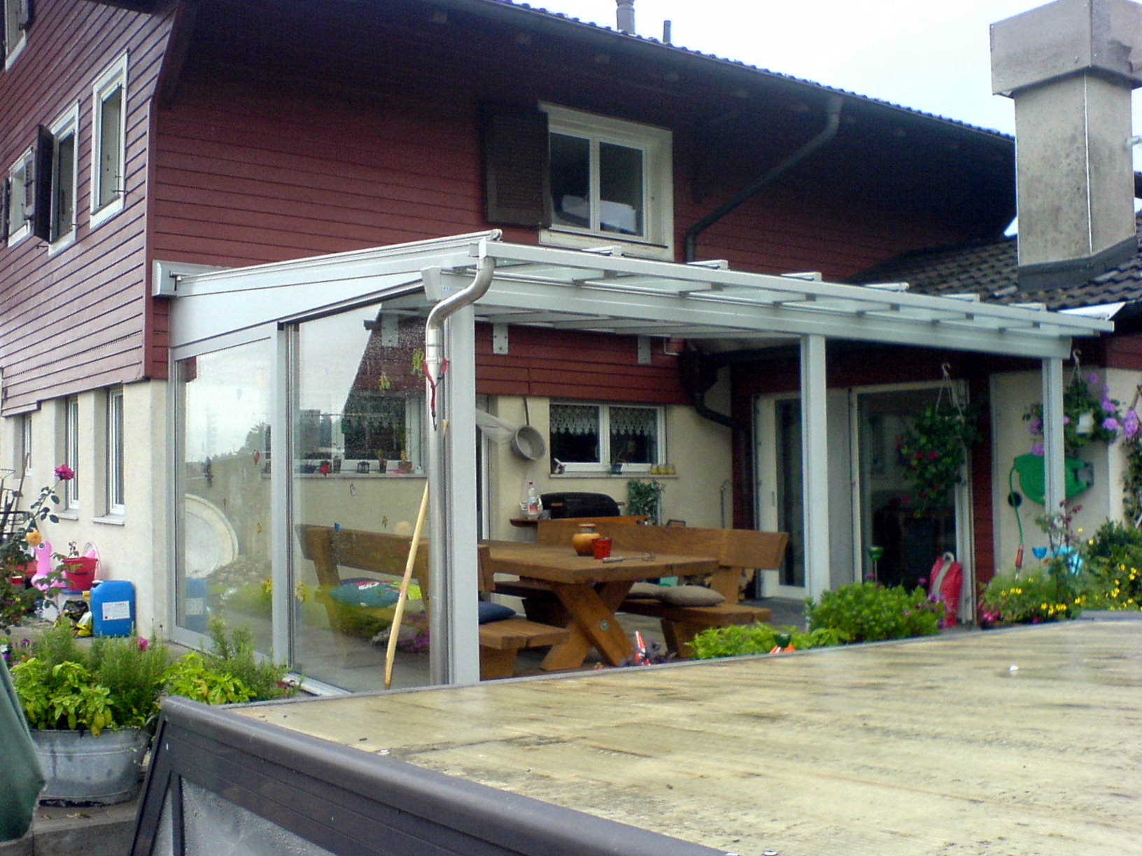 Stobag-Pergola mit integrierter Markise und seitlicher Schiebetür